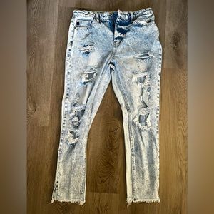 Distressed Kancan Jean. Never been worn. Size 7.